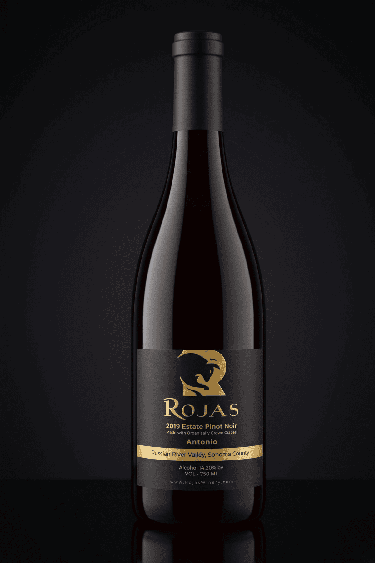 A dark wine bottle labeled Rojas 2019 Estate Pinot Noir, Russian River Valley, Sonoma County stands against a black background with gold accents and a stylized horse logo on the label.